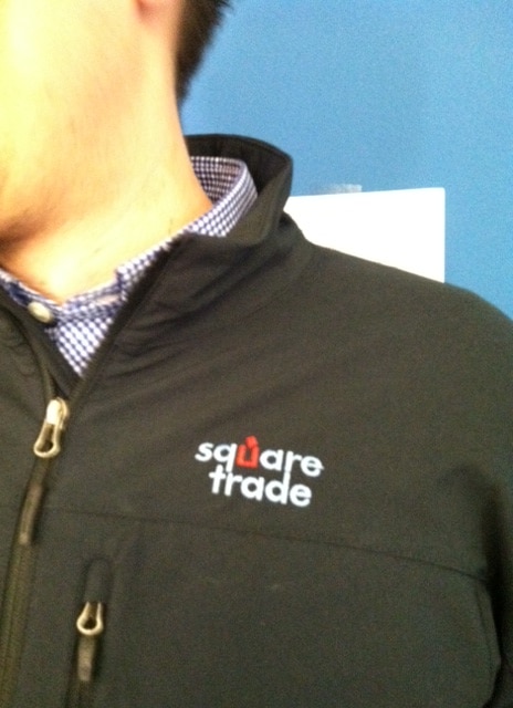 Adrien from Ops shows a close-up of the beautifully embroidered logo.